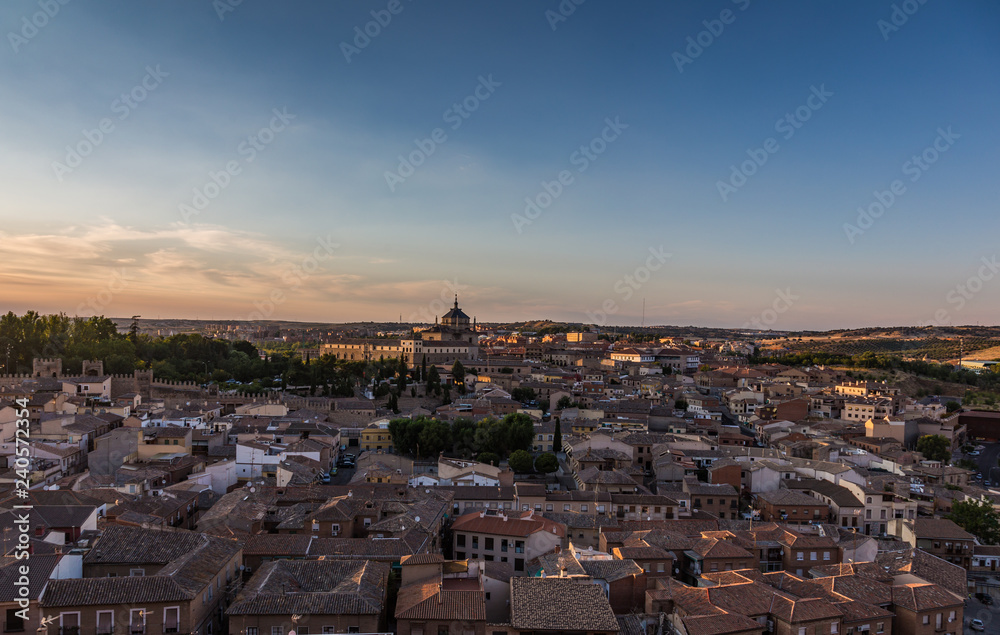 Panoramic view of the old town at sunset in Toledo, Spain.
