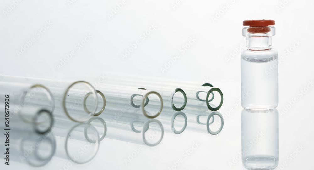 Group of vials with medication on blue methacrylate table. Group of vials with medication on blue methacrylate table.