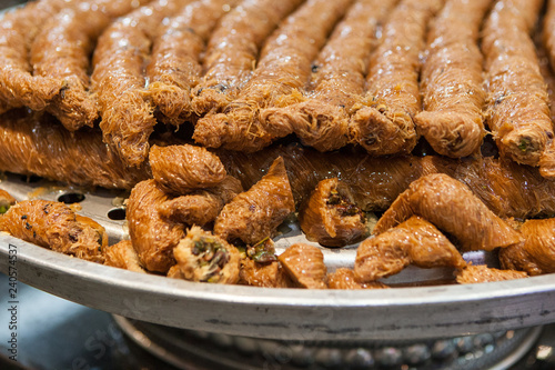 A tray of borma pistachio, a popular Middle Eastern dessert, in an Arabic bakery in Dubai, United Arab Emirates photo