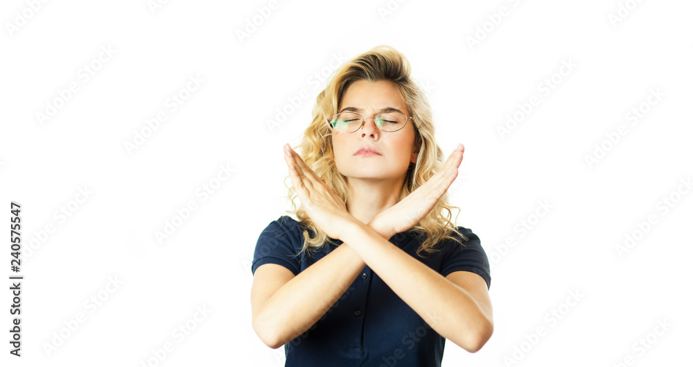 Portrait of a serious woman holding a pair of crossed hands, showing no sign, isolated on a white background. Portrait of a serious woman holding a pair of crossed hands, showing no sign, isolated on a white background.