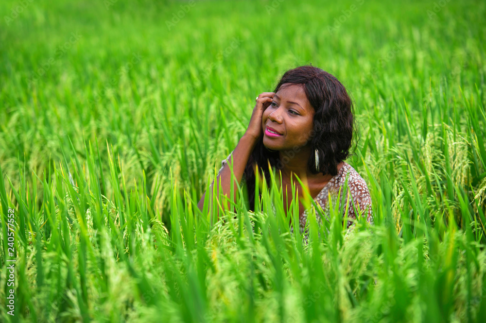 portrait of young beautiful and happy black afro American woman isolated in the middle of rice field enjoying exotic holidays trip in Asia exploring traditional village portrait of young beautiful and happy black afro American woman isolated in the middle of rice field enjoying exotic holidays trip in Asia exploring traditional village