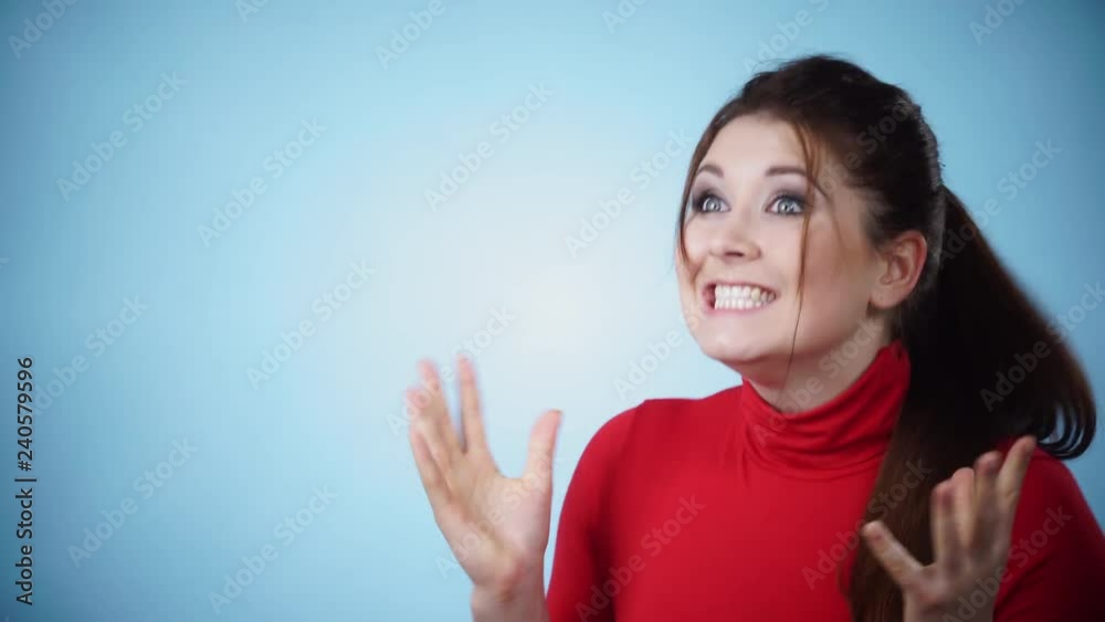 Happy positive joyful woman with arms up clenching fists of joy. Female showing her happiness. Success, achievement, winning concept. Positive emotions. 4K ProRes HQ codec Happy positive joyful woman with arms up clenching fists of joy. Female showing her happiness. Success, achievement, winning concept. Positive emotions. 4K ProRes HQ codec