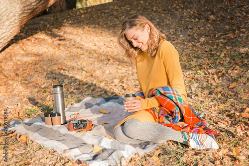 Wallpaper Mural Attractive young woman with curly hair wrapped in warm blanket outside with cup of coffee. Torontodigital.ca
