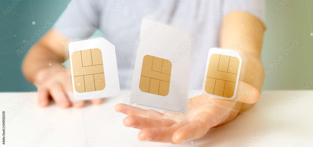 Businessman holding Different size of a smartphone sim card 3d rendering Businessman holding Different size of a smartphone sim card 3d rendering