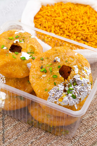 Indian Traditional Sweet Kachori Also Know As Mawa Kachori, Kachauri or Kachodi, Stuffed Kachori With Condensed Milk, Cheese and Dry Fruits And Served With Sugar Syrup photo