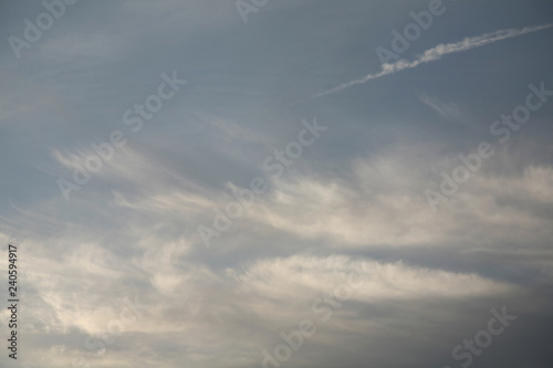 White sky background filled with beautiful clouds. Abstract pictures of heaven are obtained from the wind. Very beautiful sky in the fall when the image is gray and blue. © Vitaly Kartashev