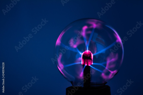 A plasma lamp with pink electricity rays. photo