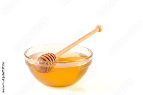 Fresh honey in glass bowl on white