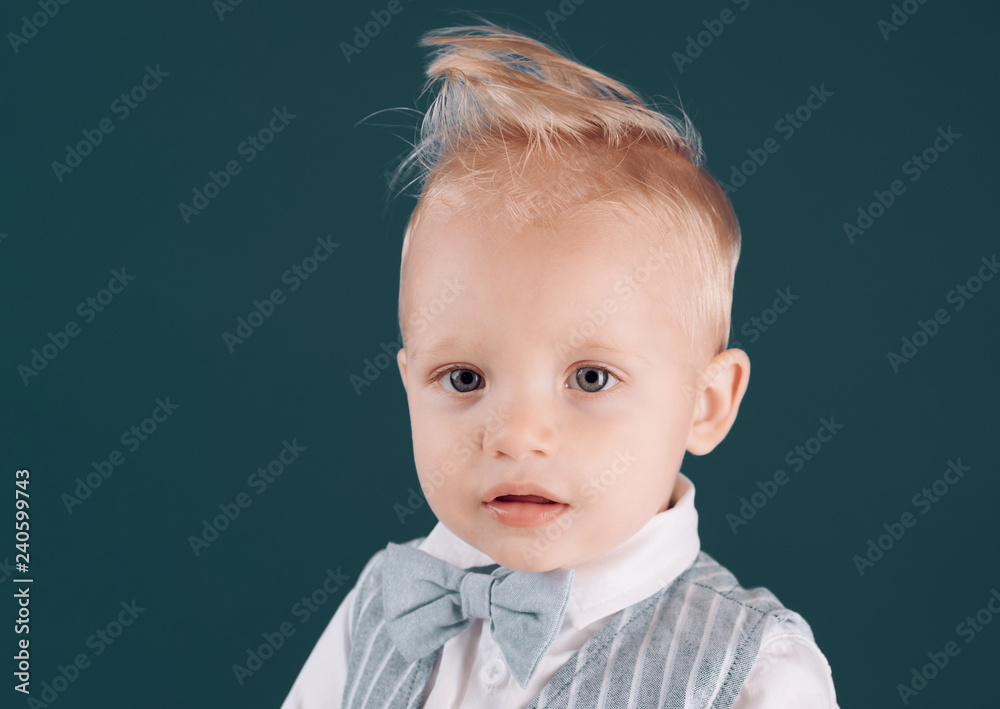 Haircut, always going to be in style. Little child with messy top haircut. Boy  child with stylish blond hair. Little child with short haircut. Healthy  haircare tips for kids. Haircare products Stock