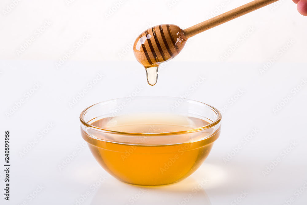 Honey with dipper and flowing honey Honey with dipper and flowing honey