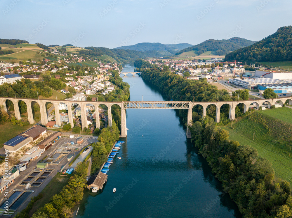 Eglisau, Switzerland August 28 2018 - Aerial image of the Railway bridge over the Rhine river at Swiss town Eglisau, Canton Zurich, which is built in 1845.