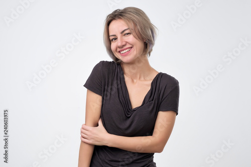 Portrait of a beautiful girl in black t-shirt on white background
