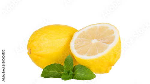 Yellow lemon with mint on a white background