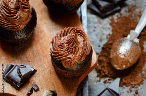 Super Moist Chocolate Cupcakes on wooden background. Selective focus, close-up. View from above.