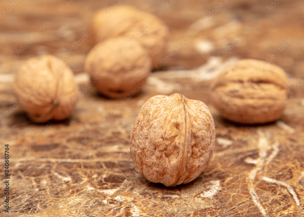 Walnuts on a marble table on the table Walnuts on a marble table on the table