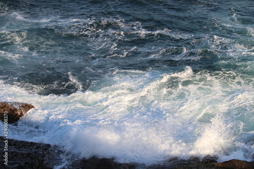 Waves crashing against the rocks
