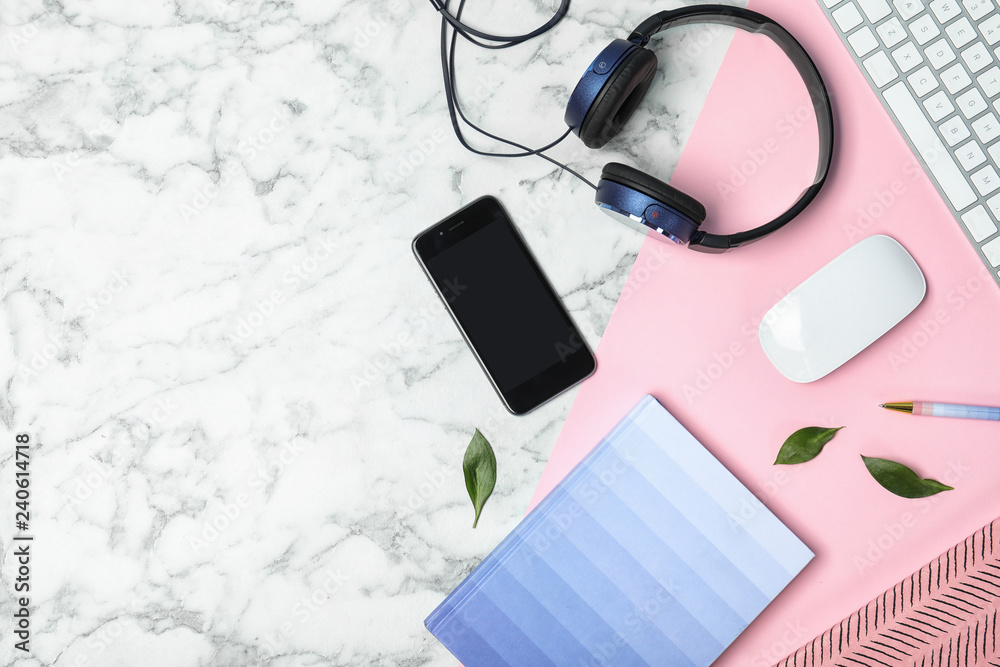 Flat lay composition with smartphone, computer keyboard, headphones and space for text on marble background Flat lay composition with smartphone, computer keyboard, headphones and space for text on marble background