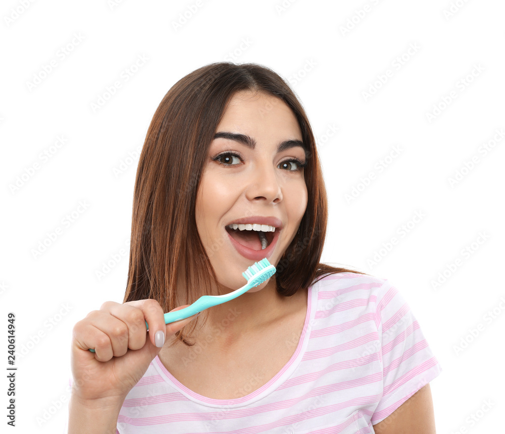 Beautiful woman brushing teeth on white background Beautiful woman brushing teeth on white background