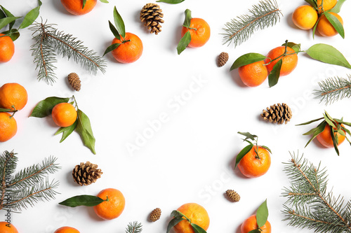 Fototapeta Naklejka Na Ścianę i Meble -  Christmas composition with ripe tangerines and space for text on white background, flat lay