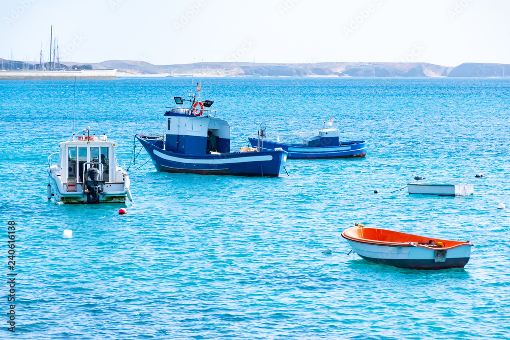 Φωτογραφία Beautiful landscape with colorful boats in a harbour in Playa Blanca, Lanzarote,