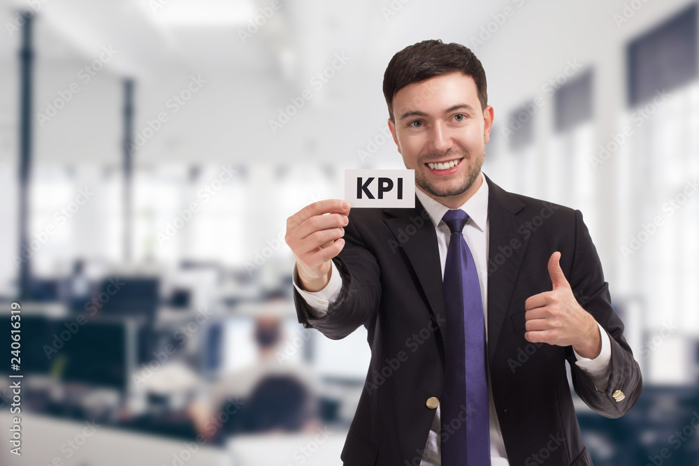 Business, technology, internet and networking concept. Young entrepreneur showing keyword: KPI Business, technology, internet and networking concept. Young entrepreneur showing keyword: KPI