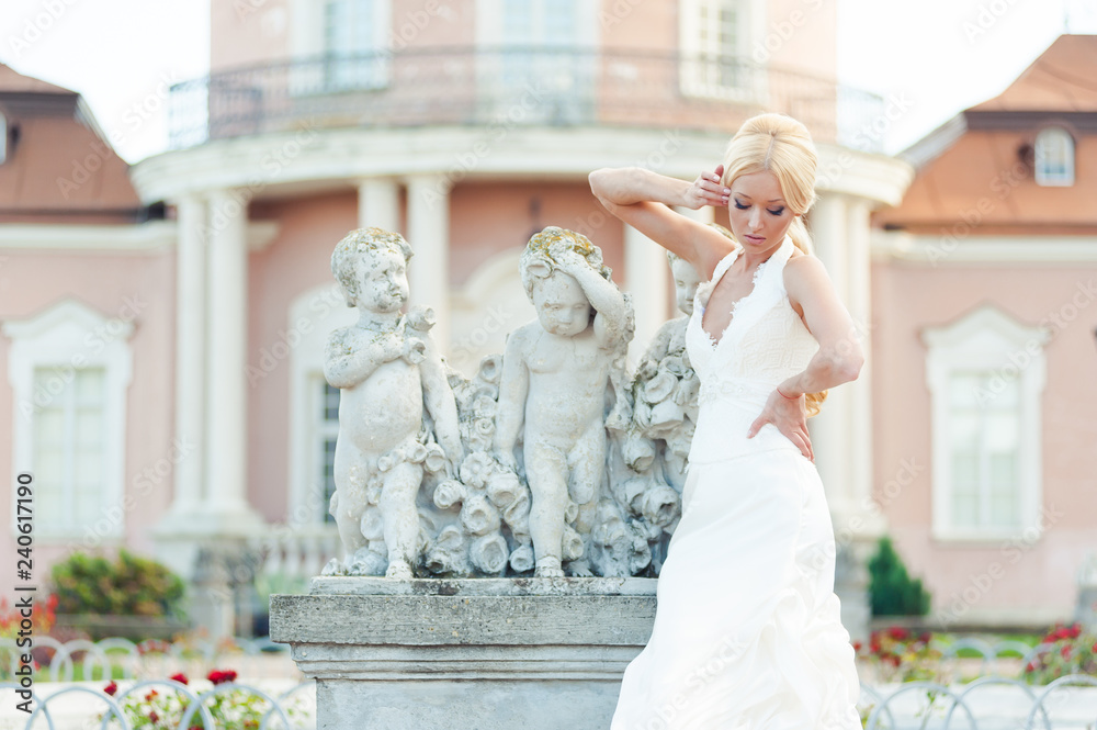 Fototapeta premium Bride blonde in a luxurious wedding dress