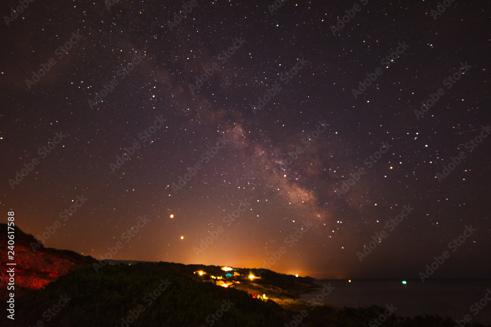 Fototapeta premium Milky way over Sardinia shoreline at night