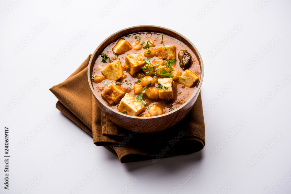 Chole Paneer curry made using boiled chickpea with cottage cheese with spices. Popular North Indian recipe. served in a bowl or serving pan. Selective focus Chole Paneer curry made using boiled chickpea with cottage cheese with spices. Popular North Indian recipe. served in a bowl or serving pan. Selective focus