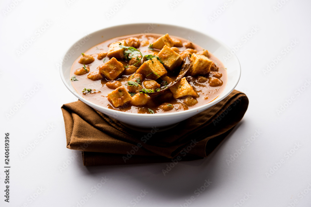 Chole Paneer curry made using boiled chickpea with cottage cheese with spices. Popular North Indian recipe. served in a bowl or serving pan. Selective focus Chole Paneer curry made using boiled chickpea with cottage cheese with spices. Popular North Indian recipe. served in a bowl or serving pan. Selective focus