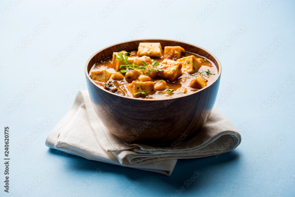 Chole Paneer curry made using boiled chickpea with cottage cheese with spices. Popular North Indian recipe. served in a bowl or serving pan. Selective focus Chole Paneer curry made using boiled chickpea with cottage cheese with spices. Popular North Indian recipe. served in a bowl or serving pan. Selective focus