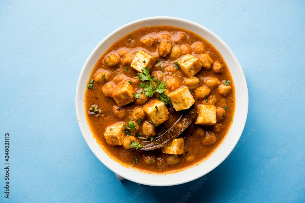 Chole Paneer curry made using boiled chickpea with cottage cheese with spices. Popular North Indian recipe. served in a bowl or serving pan. Selective focus Chole Paneer curry made using boiled chickpea with cottage cheese with spices. Popular North Indian recipe. served in a bowl or serving pan. Selective focus