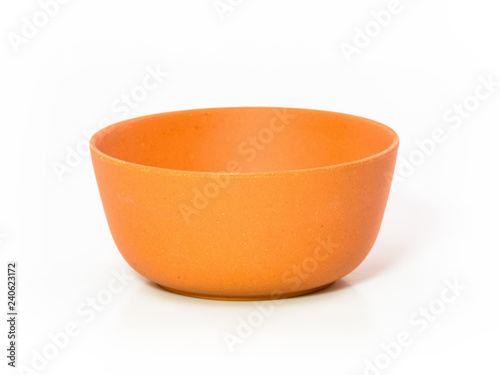 colored plastic bowls on white background