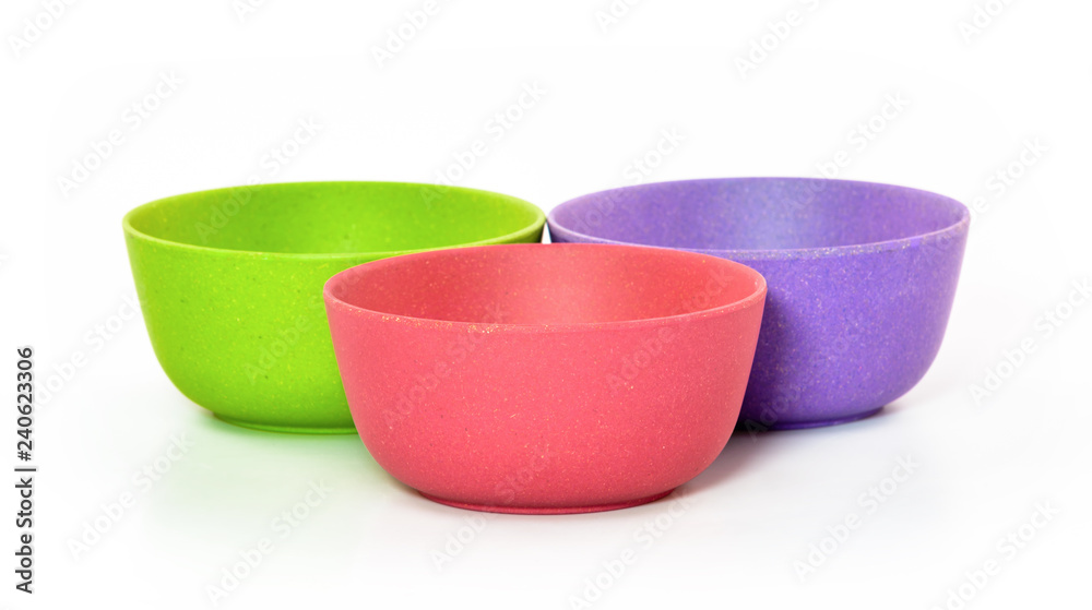 colored plastic bowls on white background colored plastic bowls on white background