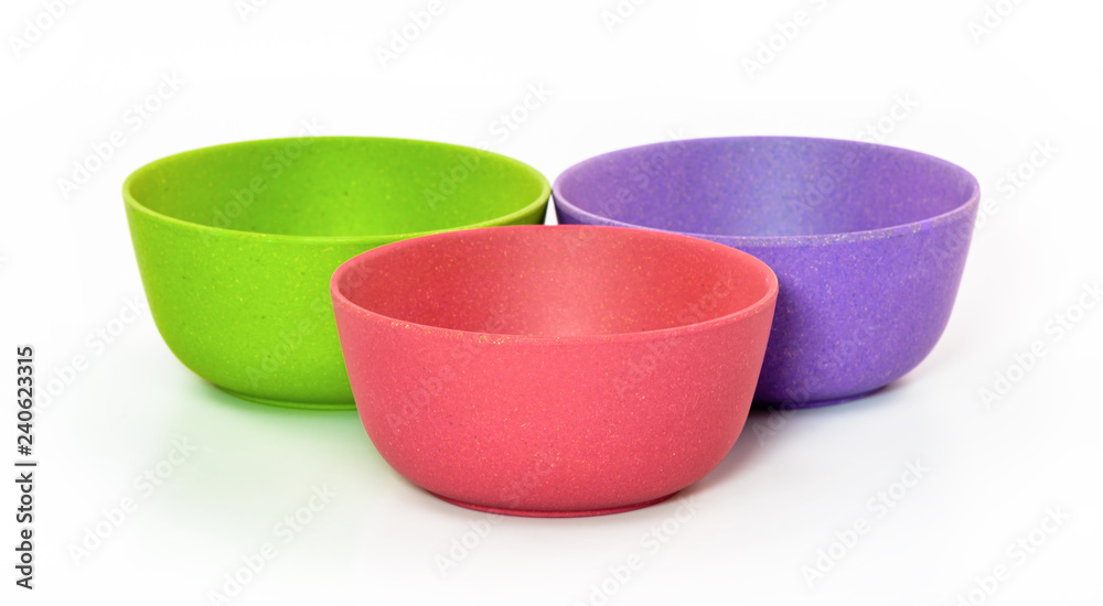 colored plastic bowls on white background colored plastic bowls on white background