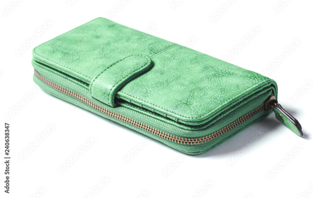Green leather purse with zipper close-up on a white background. Green leather purse with zipper close-up on a white background.