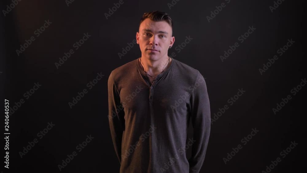 Handsome caucasian man looking at camera and waving with his head in token of disagreement Handsome caucasian man looking at camera and waving with his head in token of disagreement