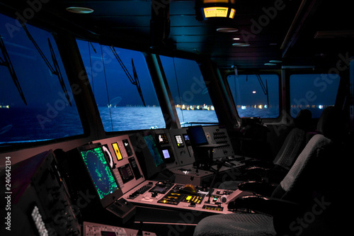 Quadro su tela Control panel of industrial cargo ship, closeup photo with selective focus and v