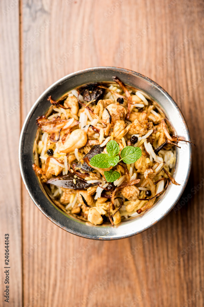Keema or Kheema Biryani - Fragrant and spicy minced lamb or goat or chicken cooked in range of aromatic spices with basmati rice. served in a karahi with curd. selective focus Keema or Kheema Biryani - Fragrant and spicy minced lamb or goat or chicken cooked in range of aromatic spices with basmati rice. served in a karahi with curd. selective focus
