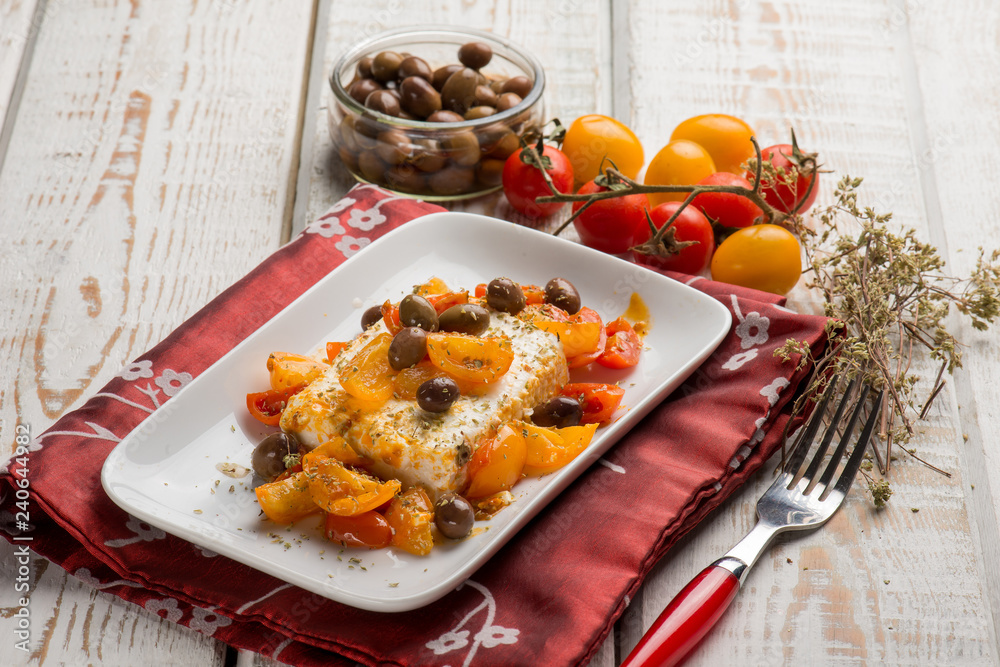 feta cheese with fresh tomatoes black olives and oregano