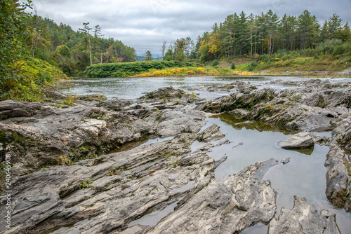 Exposed bedrock on Quechee River at Quechee Gorge bottom, near Woodstock, vermont photo
