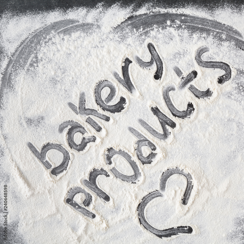 Baking background with flour on wooden table Baking background with flour on wooden table