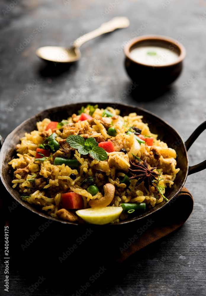 Kheema Pulao - Rice cooked with mutton or chicken mince with vegetables and spices. served in a bowl. selective focus