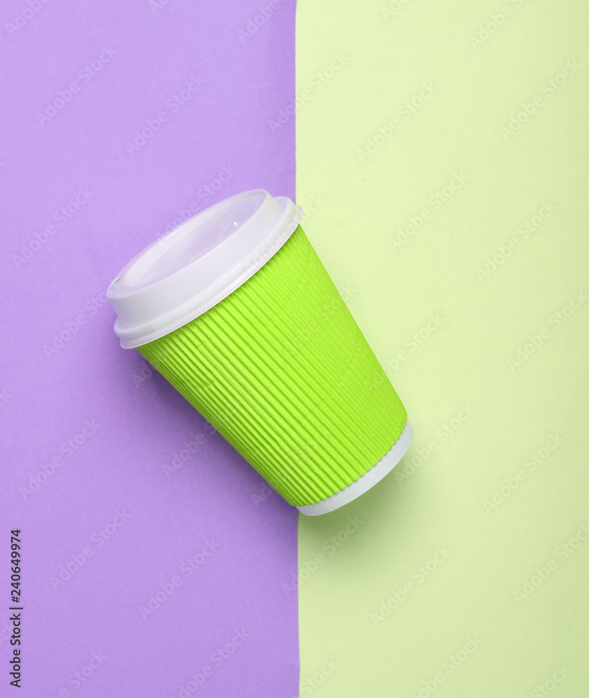 Paper green coffee cup on a colored pastel background, top view, minimalism.. Paper green coffee cup on a colored pastel background, top view, minimalism..