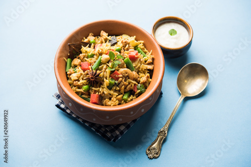 Kheema Pulao - Rice cooked with mutton or chicken mince with vegetables and spices. served in a bowl. selective focus photo