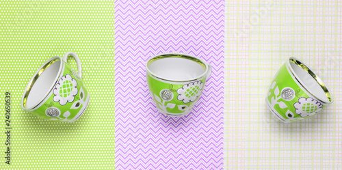 Retro cups with green patterns on tablecloth. Top view. photo