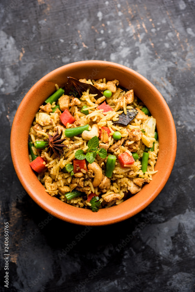 Kheema Pulao - Rice cooked with mutton or chicken mince with vegetables and spices. served in a bowl. selective focus Kheema Pulao - Rice cooked with mutton or chicken mince with vegetables and spices. served in a bowl. selective focus