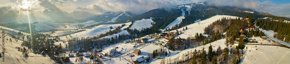 Panorama of ski resort in Carpathian mountains. Winter landscape.