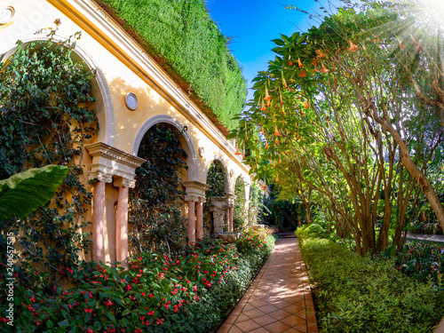 Wallpaper Mural Saint-Jean-Cap-Ferrat, France - October 10, 2018: Beautiful garden of Villa Ephrussi de Rothschild, with trees and flowers in a sunny day Torontodigital.ca