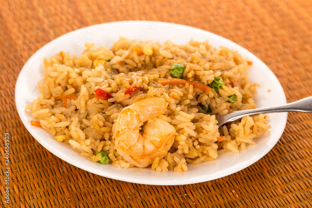 Bowl of Shrimp Fried Rice on Bamboo with Fork Bowl of Shrimp Fried Rice on Bamboo with Fork