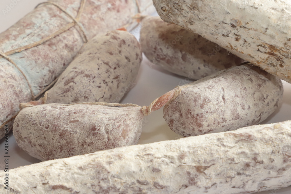 salamini o cacciatorini su sfondo bianco, salami or cacciatorini on white background salamini o cacciatorini su sfondo bianco, salami or cacciatorini on white background
